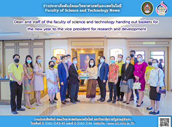 Dean and staff of the faculty of science
and technology handing out baskets for
the new year to the vice president for
research and development