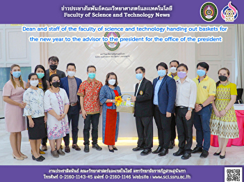 Dean and staff of the faculty of science
and technology handing out baskets for
the new year to the advisor to the
president for the office of the
president