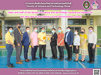 Dean and staff of the faculty of science
and technology handing out baskets for
the new year to the director of the
demonstration school